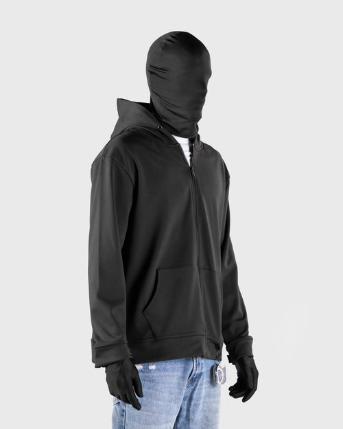 A black half-zip hoodie with a matching full-face balaclava hood, modeled on a headless mannequin wearing light blue jeans and black gloves against a light gray background.